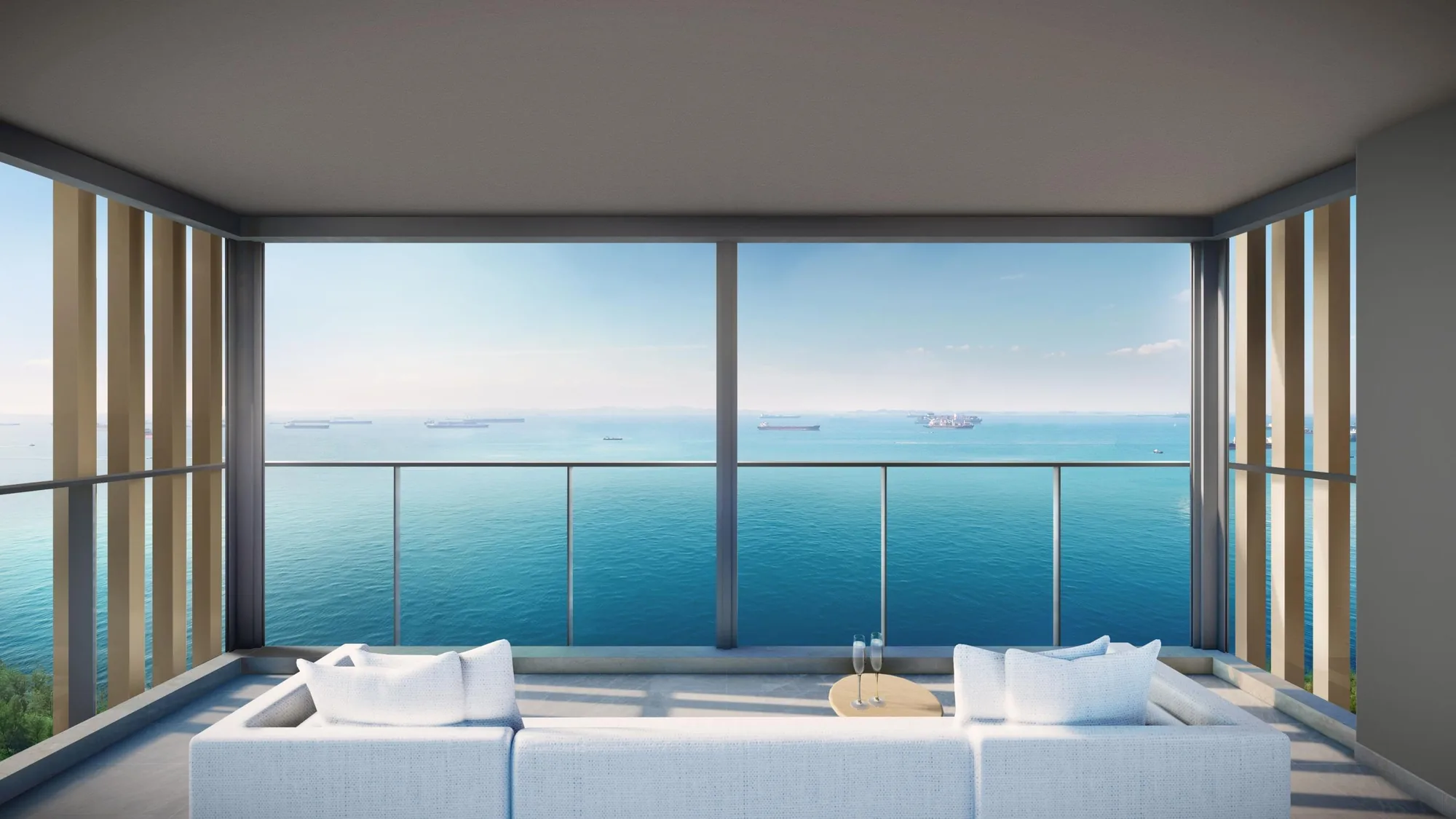 Meyer Blue, artist’s impression: a balcony with a low white sofa facing full-height glass and an open view of the sea, with ships at anchor on the horizon